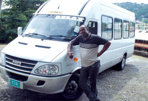 Craston poses with his new bus.