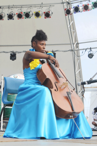Classical musician Pearl Tench plays a tribute in song to Governor-General Dame PearletteLouisy.
