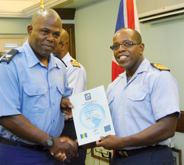 Sergant Kentry Frederick of St. Lucia receives his certificate of participated.