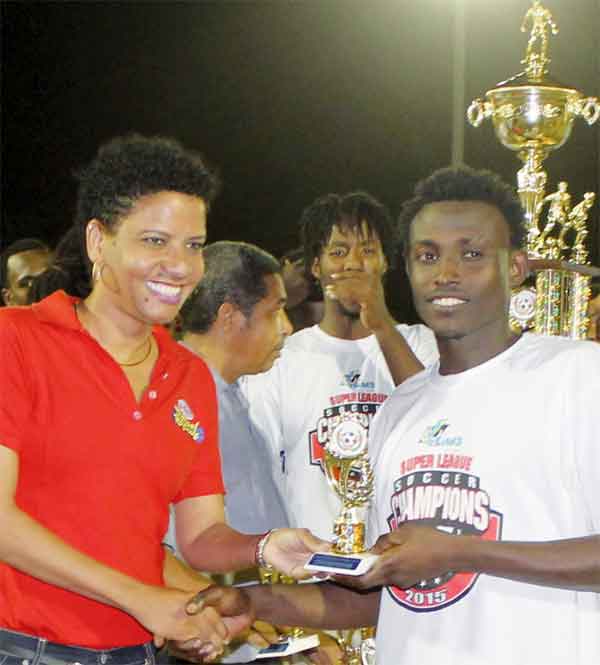 Gros Islet goal scorer No. 9 Troy Greenidge Receiving his award from Brand Manager for Grace Foods at Peter and Company. (Photo: Anthony De Beauville)