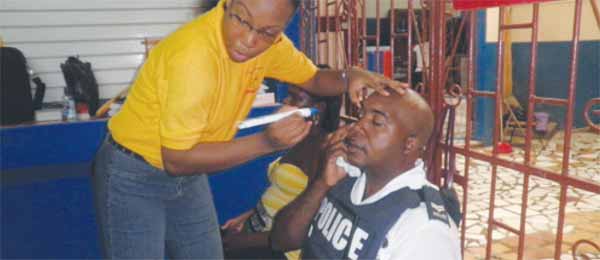 A police officer gets an eye check at SLBWA.