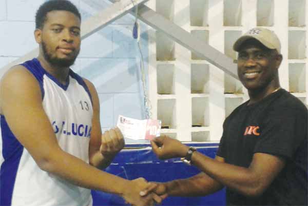 Image: Combined Schools Parkel Gumbs who scored 14 points, 7 rebounds receiving his KFC Player of the Game award from SLBF PRO Neil Joseph.