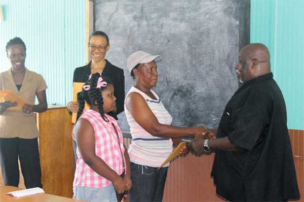 One of the beneficiary students collects her package.