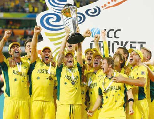 Image of fifth time champions...Michael Clarke and the Australia team celebrate with the World Cup trophy (PHOTO Getty Images Cameron Spencer)
