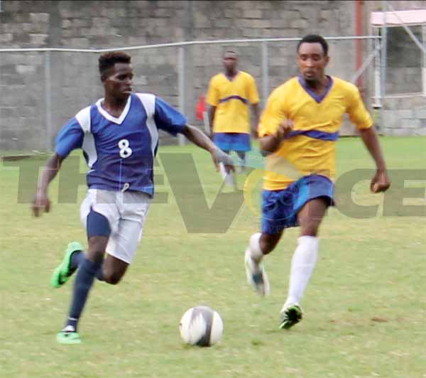 SOme of the action between defending Canaries and Gros Islet on Saturday. (Photo Anthony De Beauville)