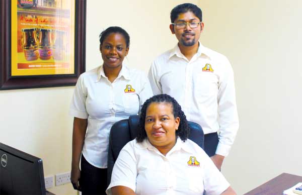 (L) to (R) Ms. Cardee Alexis, Ms. Geanelle Edgar (seated), and Mr. Hemaindra Ramjattan.