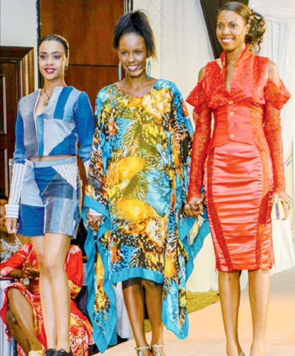 Charlery (centre) with models showing off her designs. 