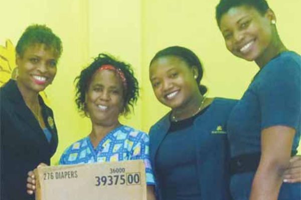 In picture from left: First Citizens Regional Manager Carole Eleuthere-Jn Marie, Daycare supervisor Marina Duplesis, First Citizens' Nicole Mc Donald and Petra Phillip at the Cul de Sac Daycare Centre.