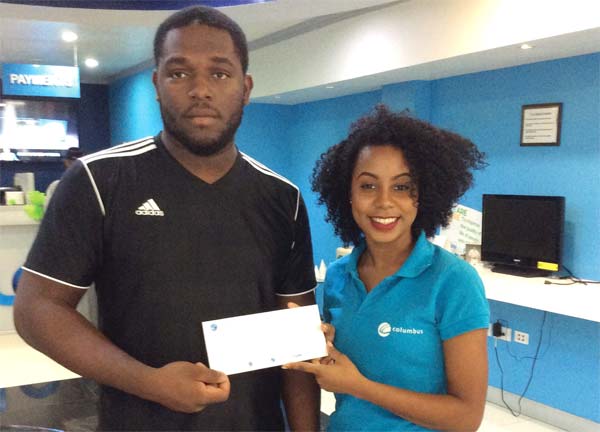 Image: Bishamber receives his cheque from Flows BibiannaMangal. Below is Lance Mathurin.