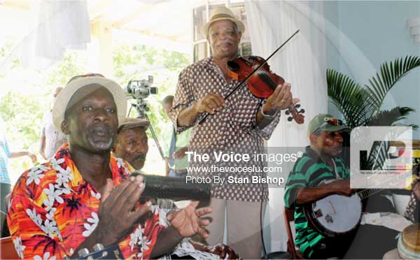 Image: Band leader Augustin “Charley” Julian and some of the band members performing at the Folk Research Centre. [PHOTO: Stan Bishop]