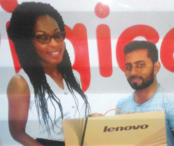 Ahmad collects from Digicel’s Louise Victor.