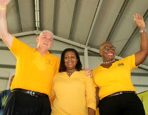 Image: Chastanet, Flood-Beaubrun and Dr. Rigobert thanking the delegates last Sunday. [PHOTO: Stan Bishop]