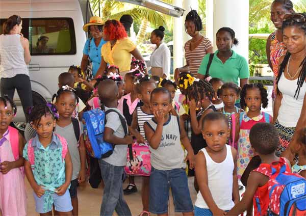 Image: Children from the south being entertained at Coconut Bay.