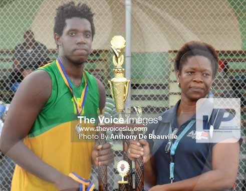 (L-R) SALCC captain No. 15 Jaryl Bernard receiving the championship trophy from school Youth and Sports Officer/Coordinator Isabel Marquis. (PHOTO: Anthony De Beauville)