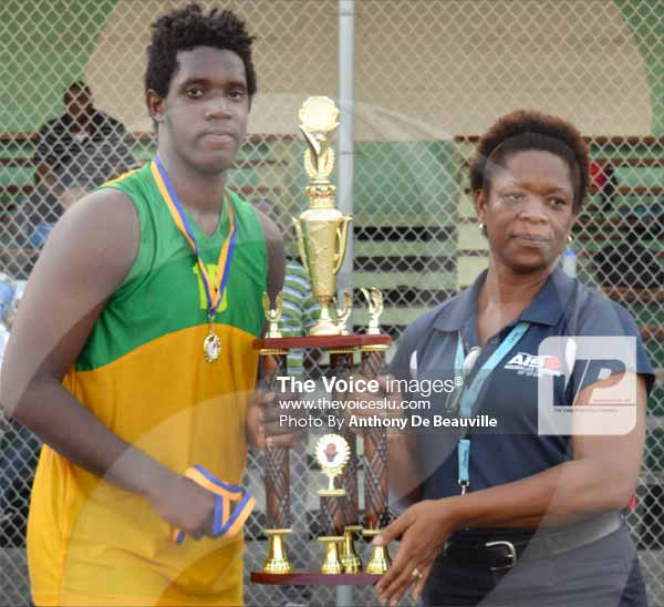 (L-R) SALCC captain No. 15 Jaryl Bernard receiving the championship trophy from school Youth and Sports Officer/Coordinator Isabel Marquis. (PHOTO: Anthony De Beauville)
