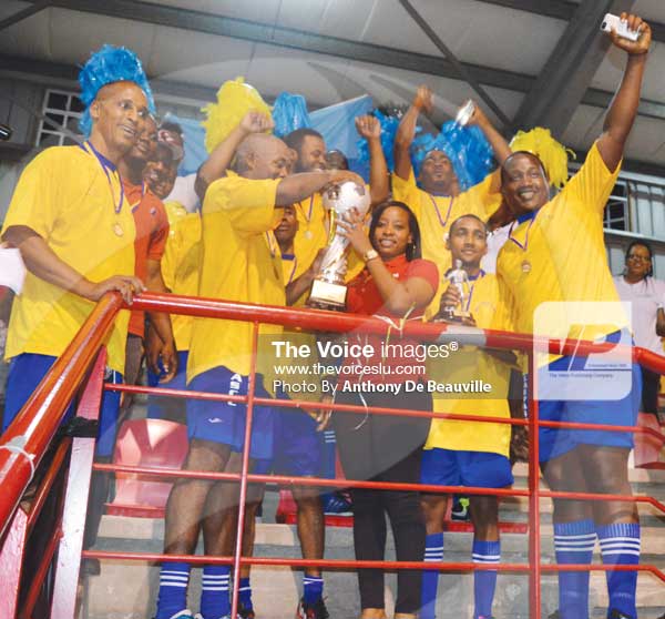 Image: Digicel Representative presenting the championship trophy to SLASPA Captain Andrew Charles (Photo Anthony De Beauville)