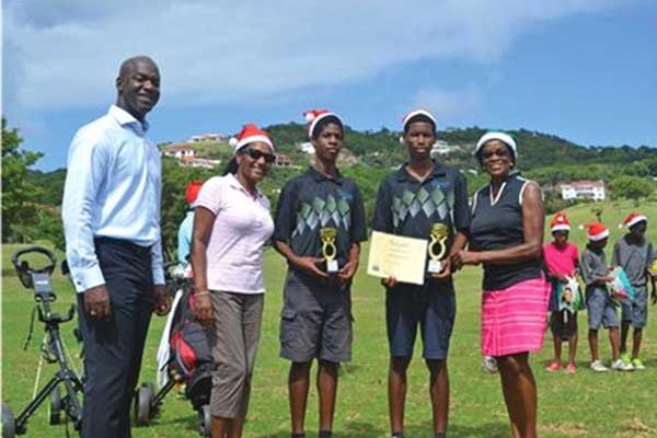 Grow Well Cup winners Samuel Richelieu (2014) and Rayshorn Joseph (2015) with The Landings General Manager Wilbert Mason, Grow Well monitor Christina Jules and program director Colleen Newman.