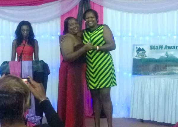 Ruthy Victorin-Prospere receives her long service award from Ms.Junai