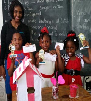 Image: Winners from the Les –Etangs Combined School with Soufriere loans officer Ms.Niah Joseph.