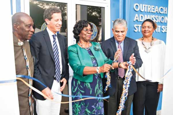 Image: Governor General, Dame PearletteLouisy cuts ribbon to ceremoniously open new location. Also in photo: Director of Administration, Gus Small, Executive Vice President, Marc Jerome, Sonia Alexander, Director of Academics and Senior Vice President, Dr. Alex Ephrem. (Photo: Bill Mortley)