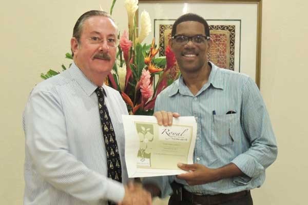 Image: Kenneth Casimir accepts his prize from Royal GM.