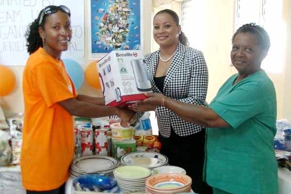 Image: Esnard presenting gifts to the Soufriere hospital.