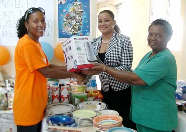 Image: Esnard presenting gifts to the Soufriere hospital.