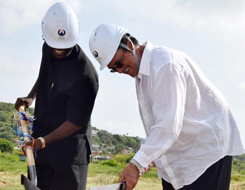 PM Anthony and NIC Director Matthew Mathurin break the ground to start construction