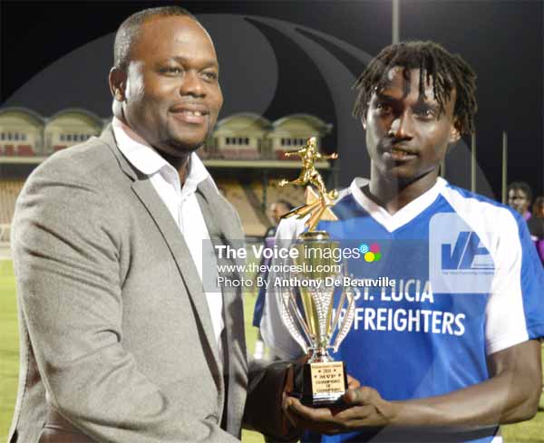 Image: (L-R) Trinidad and Tobago professional footballer Stern John presenting the MVP awared to Gros Islet player Troy Greenidge. (PHOTO: Anthony De Beauville)