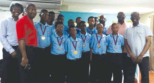 Image: A proud moment for the 2016 Windwards Under-15 Champion Cricket Team along with government officials on Sunday. (PHOTO: AC