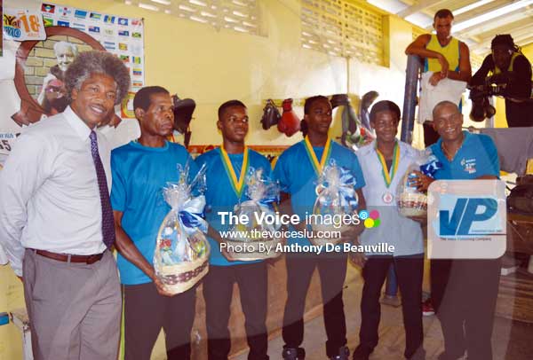 Image: (L-R) Acting PS Youth Development and Sports Sr Anthony George, Coach- Conrad Fredrick, Boxers-Kareem Boyce, Nathan Ferrari, Tahj Brown and SLBA President -David Christopher (Photo by Anthony De Beauville)