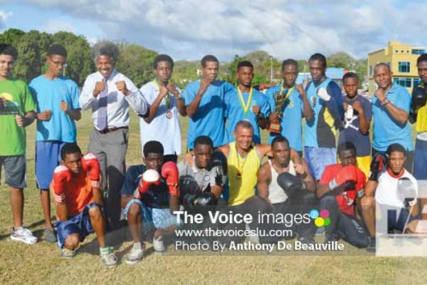 Image: A photo moment for some of the boxers that will be on show today with PS Youth Development and Sports Dr. Anthony George and SLBA President David Christopher (Photo Anthony De Beauville)