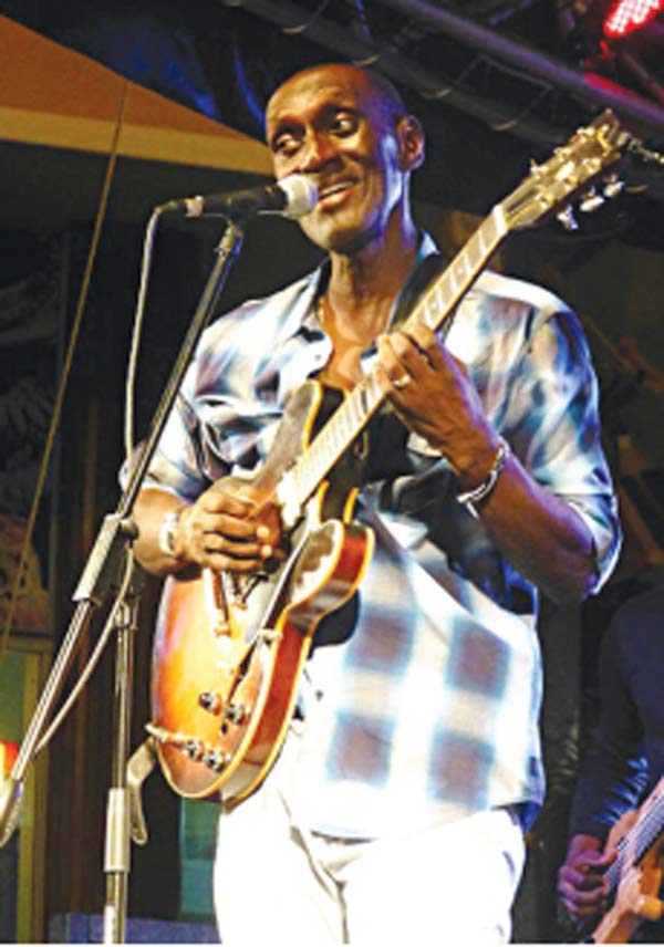 Image: Ronald “Boo” Hinkson performs on the Rodney Bay Strip for Artists Market