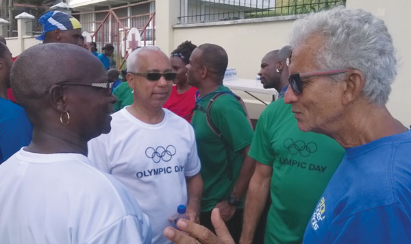 img: What could the trio be discussing? SLOC President Fortuna, SLOC 1st Vice President Teddy Matthews and former OECS Sports Director David Peterkin (Photo SLOC)
