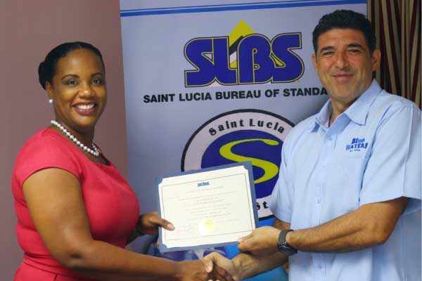 Image: Dr. Walcott presents the SLBC standard to Blue Waters