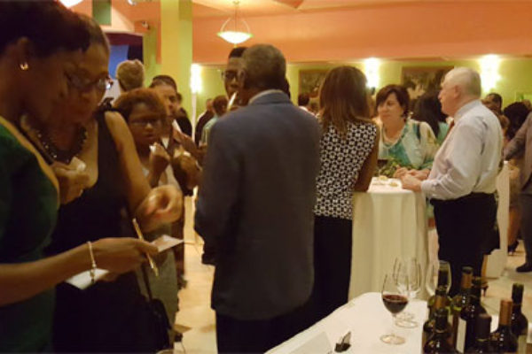 Image: Guests viewing the wine selection from event sponsors La Cantina Wines and Barbay Ltd.