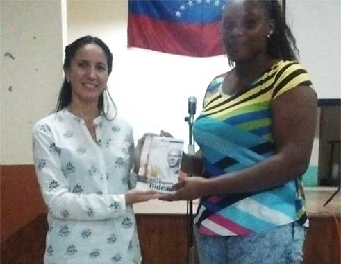 Image: Venezuelan Ambassador presents copies of the book on Bideau to one his descendants