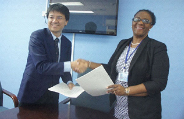 Image: Mrs. Allison A.Jean, Permanent Secretary, Ministry of Infrastructure and Mr.Sakabe, leader of the preparatory survey team of JICA following the signing of the Minutes of Discussions.