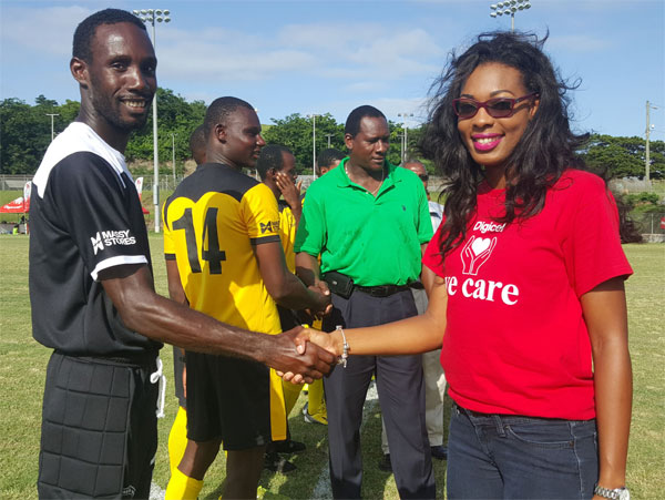 Image: Ms. Victor and Northern U Captain Giovanni Deterville shake hands