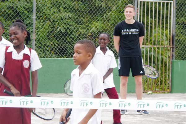 Image: Students getting tennis lessons.