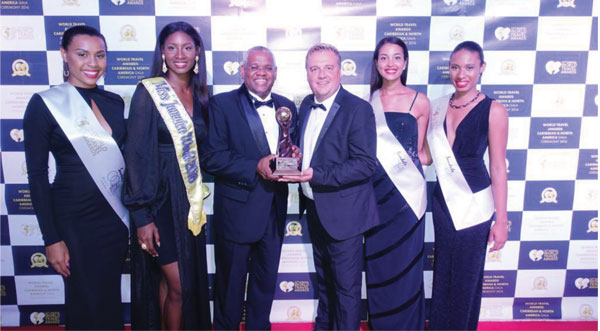 img: : [From left to right: World Travel Awards representative, Ashlie Barrett, Miss Jamaica World 2016, David Shields, Vice President of Sales, Island Routes Caribbean Adventures, Chris Frost, Vice President, World Travel Awards, World Travel Awards representative, World Travel Awards representative]