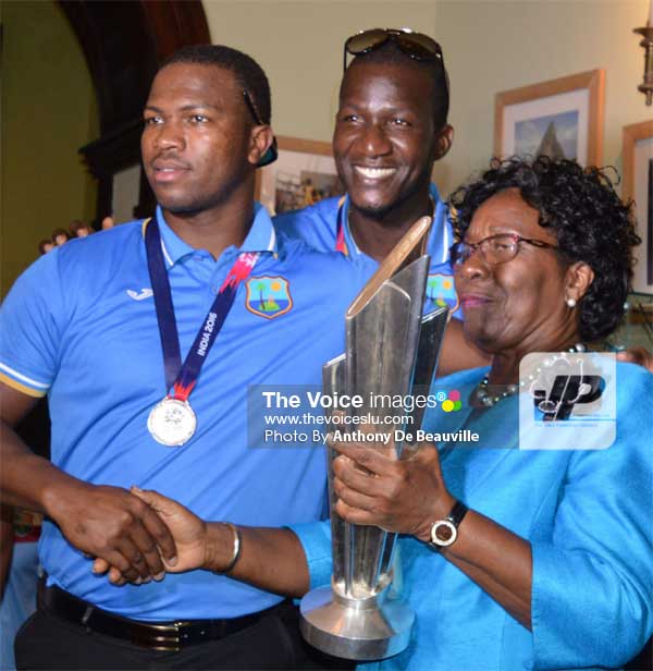 Image: Daren Sammy and Johnson Charles share a moment of glory with St. Lucia’s Governor General Dame PearletteLouisy. (PHOTO: Anthony De Beauville)