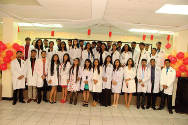 img: The latest batch of medical students at Spartan University in Vieux Fort