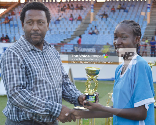 IMG: SLFA President Lyndon Cooper presenting the trophy for most Goals in the tournament (9) to Sasha Prospere of Soufriere. (Photo Anthony De Beauville)
