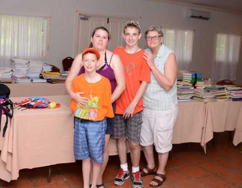 Image: Noah and his family before repacking boxes for school.