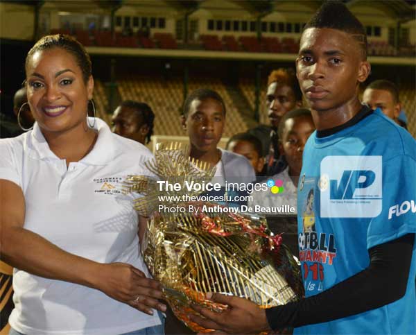 Image: (L-R) St. Lucia Distillers representative presenting award to VFS goalkeeper Leon Alexander, the MVP of the tournament. (PHOTO: Anthony De Beauville)