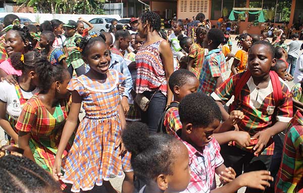 Image: Students of the Gordon and Walcott Memorial School in Castries (left) and Grace Combined in Vieux Fort (right) in the thick of JounenKweyol activities yesterday.