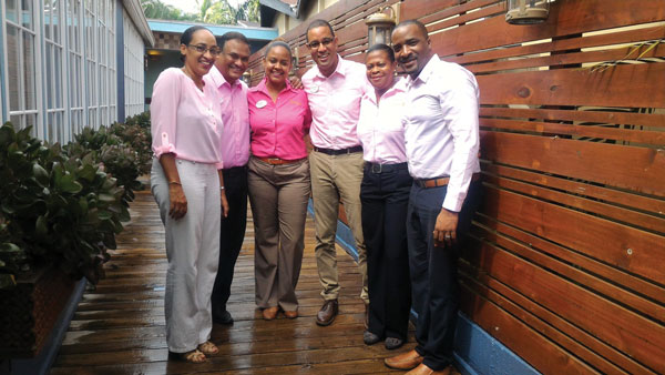 img: Front Office team members at Sandals La Toc show support with pink; 2. The team at Sandals Halcyon all wore pink in honour of breast cancer awareness on Friday