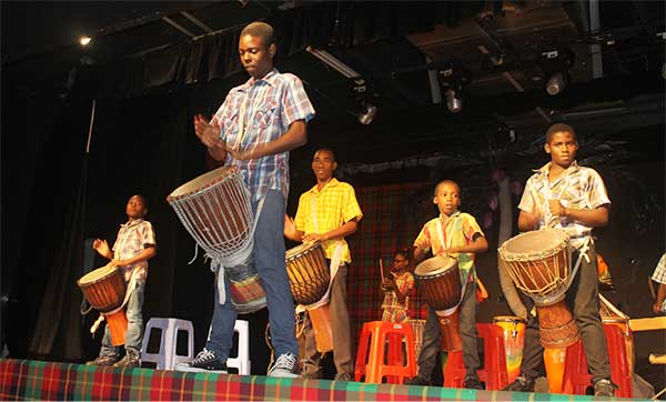 Image of Young drummers entertaining.
