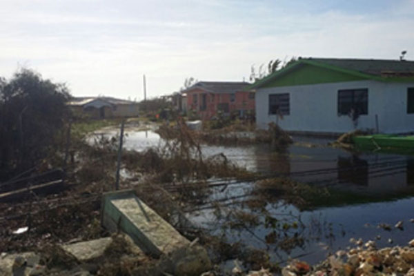 img: Houses in Andros flooded as a result of heavy rains caused by Hurricane Matthew.